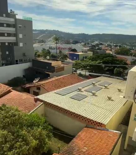 a view of the roofs of buildings in a city at Edifício Paris 411 in Lagoa Santa