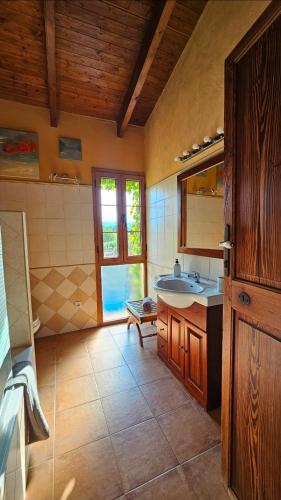 a bathroom with a sink and a mirror at Sa Sort Llarga in Moscari