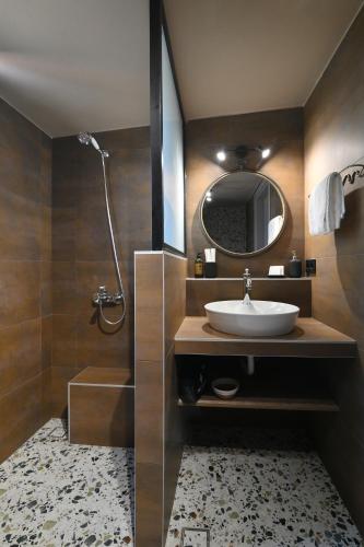 a bathroom with a sink and a mirror at Liostasi Villas by Olga in Leptokarya