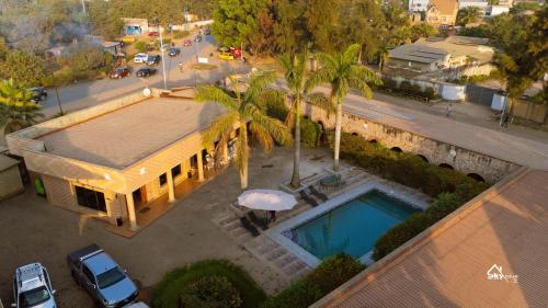 an overhead view of a house with a swimming pool at Skyblue GuestHouse in Lubumbashi