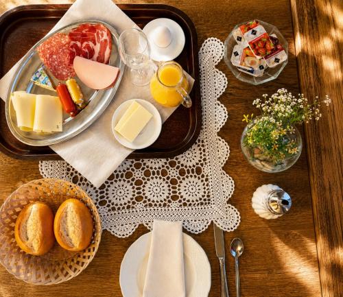a table with a tray of food on a table at Hotel Kull von Schmidsfelden in Bad Herrenalb