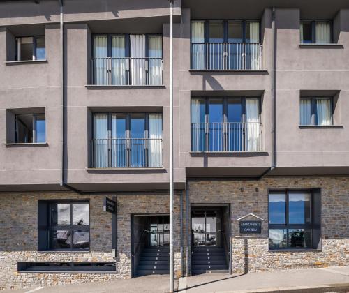 an external view of a building with windows at Estival Caribou Apartments in Pas de la Casa