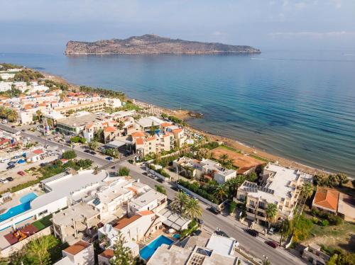 an aerial view of a city and the ocean at Elotis Suites in Agia Marina Nea Kydonias