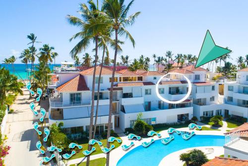an aerial view of a resort with a pool and slides at Los Corales CASAS DE LAS TERRAZAS Bavaro POOL VIEW HOTEL Bavaro Beach CLUB & SPA in Punta Cana