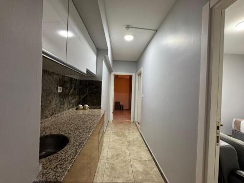 a hallway with a sink in a room at Silvercity Hotel&Suits in Eskisehir