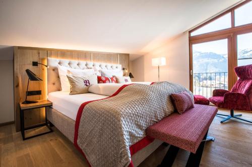Кровать или кровати в номере Sport-Wellnesshotel Bichlhof