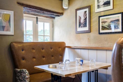 a table and a chair in a restaurant at Havener's in Fowey