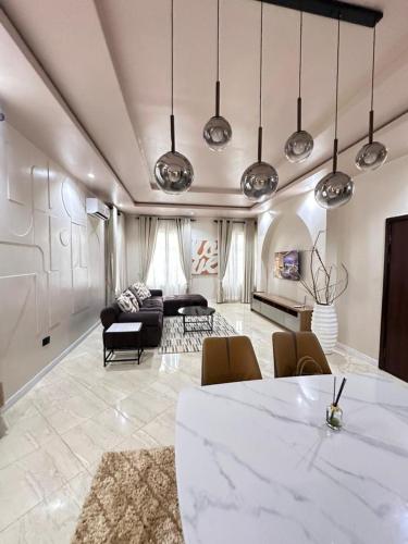 a large living room with a table and chairs at Raya in Lagos