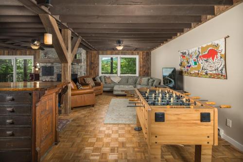 a living room with a large chess board on a table at Majestic Mountain Haus in Beech Mountain