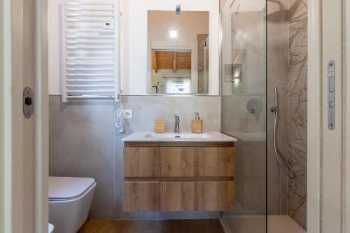 a bathroom with a sink and a shower at B&B I Menhir "nel Bosco" - Affittacamere in Lerici