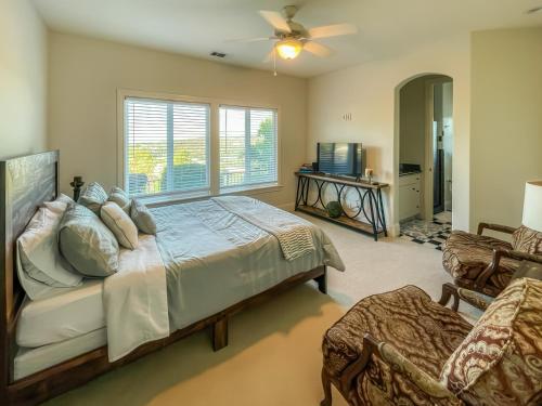 a bedroom with a large bed and a window at Serrano Village Villa in El Dorado Hills
