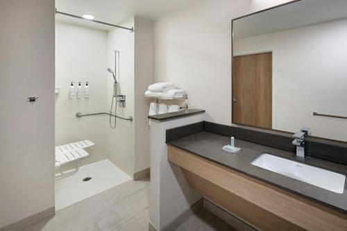 a bathroom with a sink and a mirror at Fairfield Inn & Suites by Marriott Melbourne Beach in Melbourne