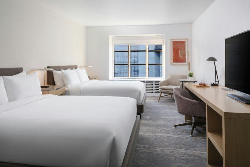 a hotel room with two beds and a desk at Marriott Vacation Club®, San Francisco   in San Francisco