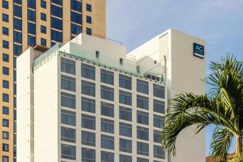 a white building with a sign on top of it at AC Hotel by Marriott Panama City in Panama City