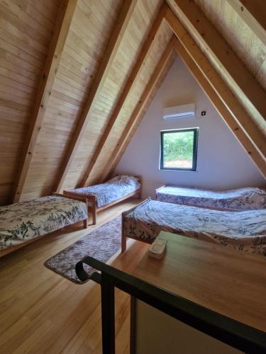 a room with three beds in a attic at River Zen House in Šipovo