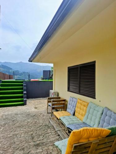 a couch sitting on the patio of a house at Relax House - Casa Castor in Valdosende