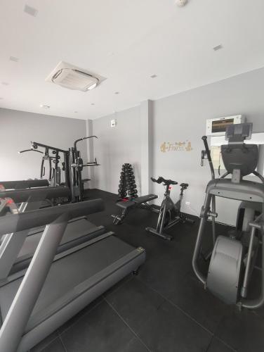 a gym with two treadmills and two exercise bikes at Babylon Sky Garden 2 in Rawai Beach