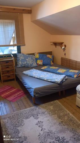 a bedroom with a large bed in a room at Chata Johanka in Stachy