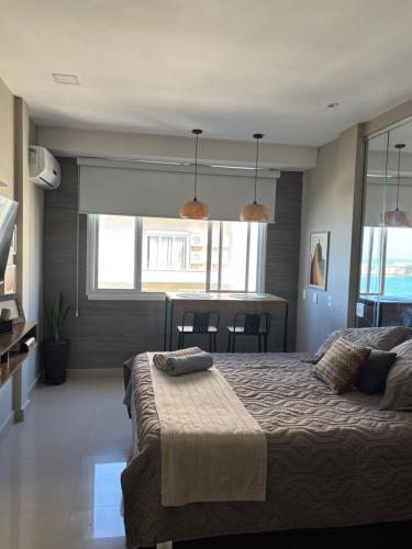 a bedroom with a large bed with two pillows on it at Studio miguel II in Rio de Janeiro