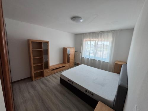 a small bedroom with a bed and a window at Landshuter str 17 in Straubing
