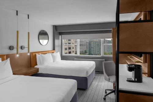 a hotel room with two beds and a window at ARC Hotel, Washington DC, Series by Marriott in Washington, D.C.
