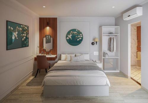 a bedroom with a large bed and a desk at Boutique KAS Luxury Hotel in Ho Chi Minh City