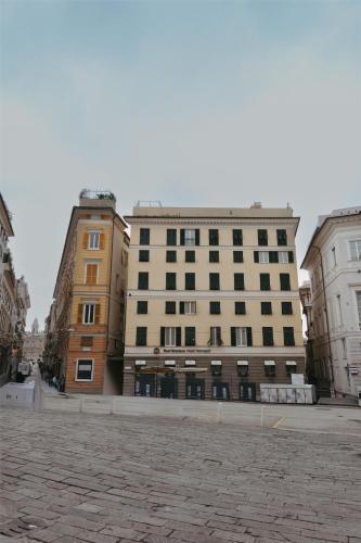a group of buildings on a city street at Best Western Hotel Metropoli in Genoa