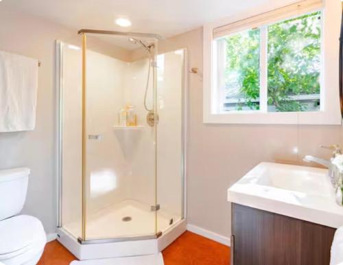 a bathroom with a shower and a sink at Star Studio, A Garden Retreat near University of Oregon in Eugene