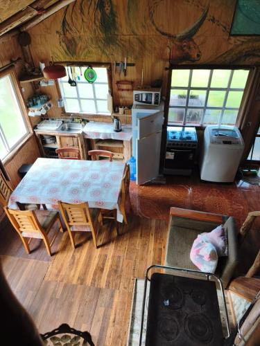 an aerial view of a kitchen and living room in a rv at Birloche in Butalcura