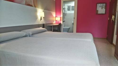 Cama o camas de una habitación en Hotel Sabiote