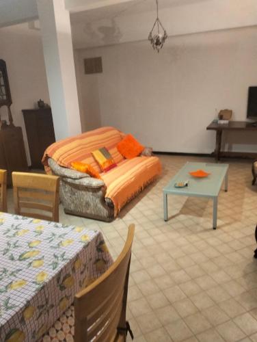 a room with a bed and a table in it at La roccia in Mezzanego