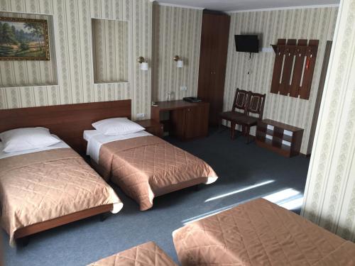 Tempat tidur dalam kamar di Yantar Hotel