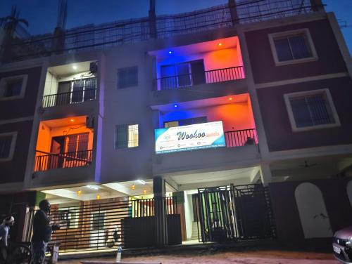 a building with a sign on the side of it at Woohoo Hotels in Patna