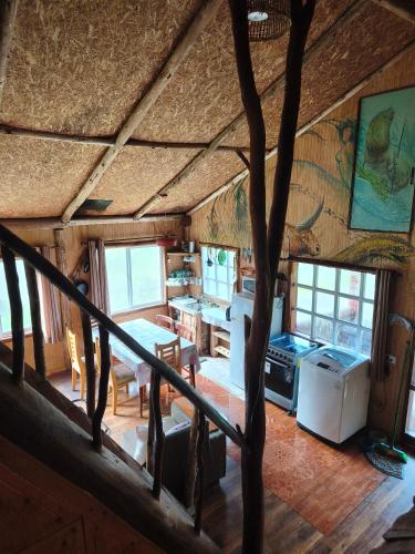a view of a kitchen and dining room of a house at Birloche in Pindapulli