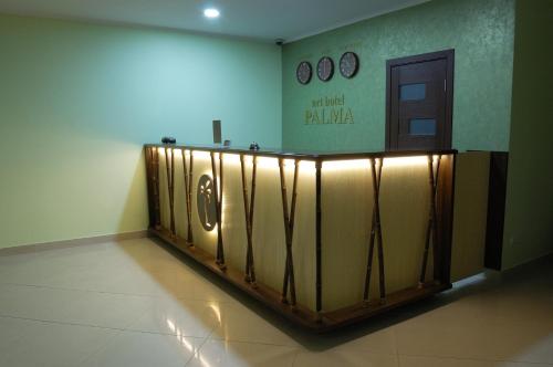 a lobby with a metal railing in a building at Art Hotel Palma in Lviv