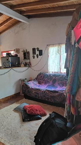 a bedroom with two beds and a window at Sendero Ancestral in Guarne