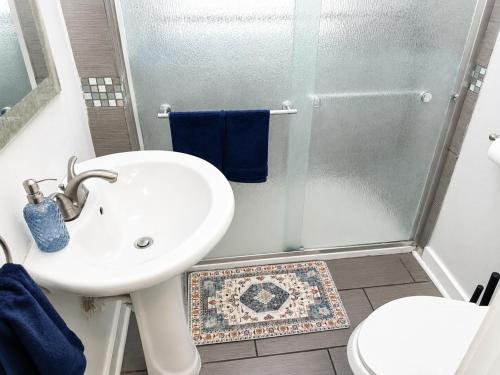 a bathroom with a sink and a shower at Convention District Studio - Downtown Houston in Houston