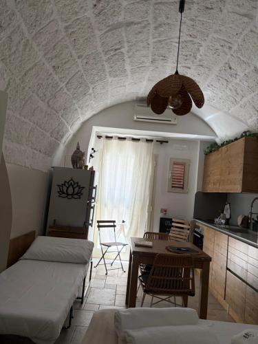 a living room with a couch and a table at Wonderhouse in Polignano a Mare