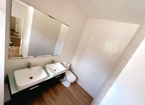 a bathroom with a sink and a mirror at Hotel Bloom Garden Beach Punta Cana in Punta Cana