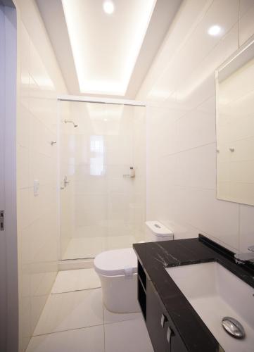 a bathroom with a shower and a toilet and a sink at Patrimonial Hotel Boutique in Cochabamba