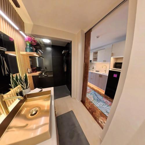 a small kitchen with a sink in a room at Raffy White Boracay in Boracay