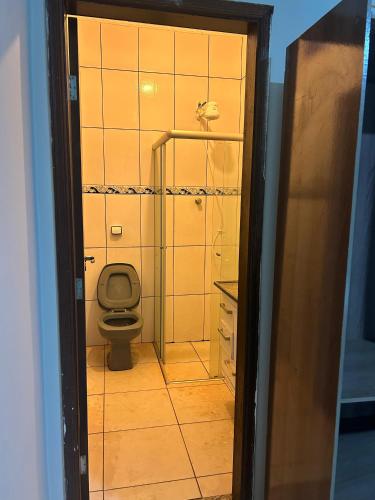 a bathroom with a toilet and a sink at Chácara HZ in Sao Jose do Rio Preto