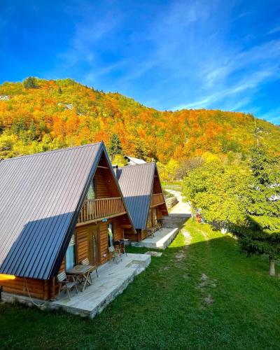 an aerial view of a cabin with a hill in the background at Bujtina n'kullë in Boge