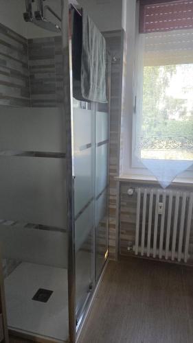 a room with a bunk bed and a window at Green House Residence in Pinerolo