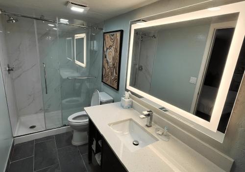 a bathroom with a sink and a shower and a toilet at Quality Inn Casa Grande I-10 in Casa Grande