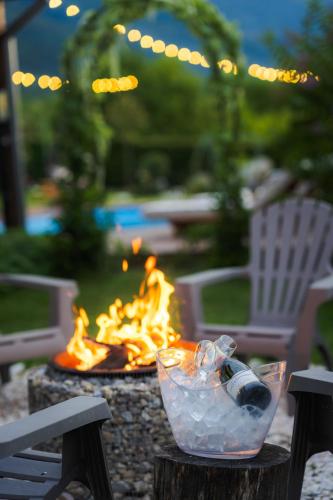 a fire pit with a bottle of water and ice at Villa Manevi in Yavornitsa