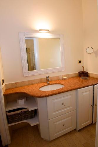 a bathroom with a sink and a mirror at Calycanto in Tempio Pausania