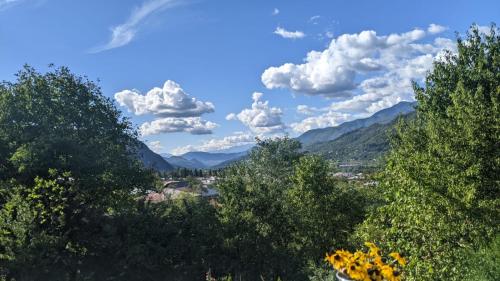 a group of trees with mountains in the background at Villa Maiseli in Ambrolauri
