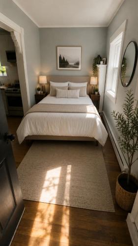 a bedroom with a large bed and a rug at Central, Dog Friendly, Parking in Saint John