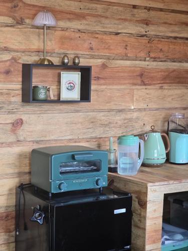 a kitchen with a printer on top of a counter at Altos del Dragón in Valle de Anton